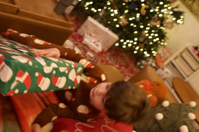 Cozy Christmas Morning Gift Opening by the Tree