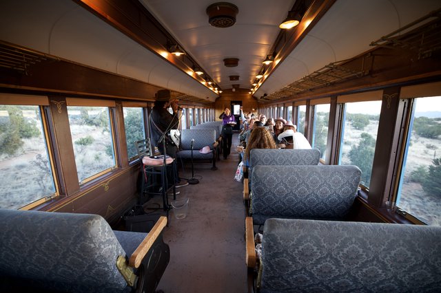 Vintage Train Car Entertainment Experience in Desert Landscape