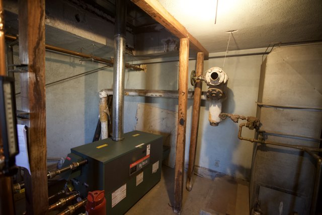 Gas Furnace and Pipes in a Small Room