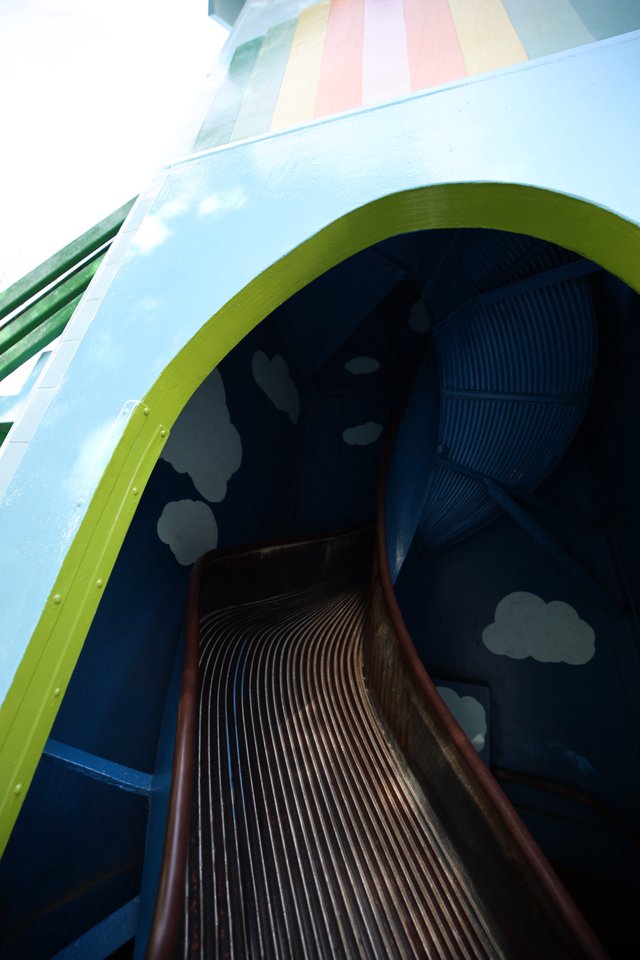 Whimsical Rainbow Slide Through Pastel Sky Portal