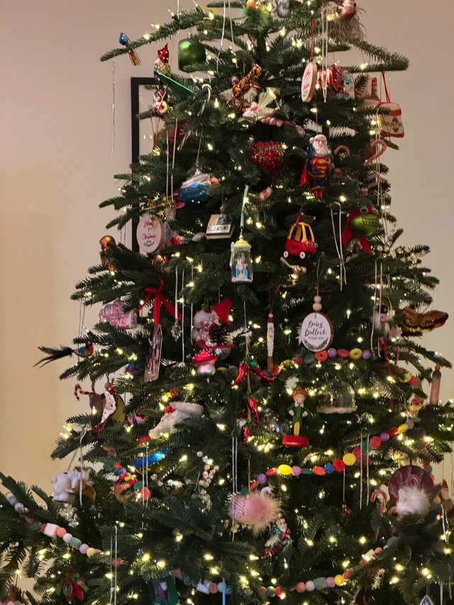 Festively Decorated Christmas Tree with Eclectic Ornament Collection