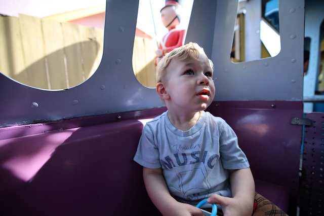 Young Boy's Wonder at Fantasyland Playground