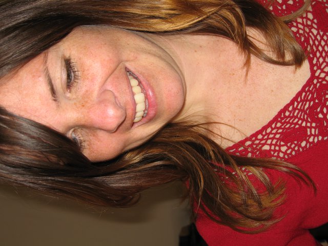 Joyful Woman Smiling Downward on Christmas Day