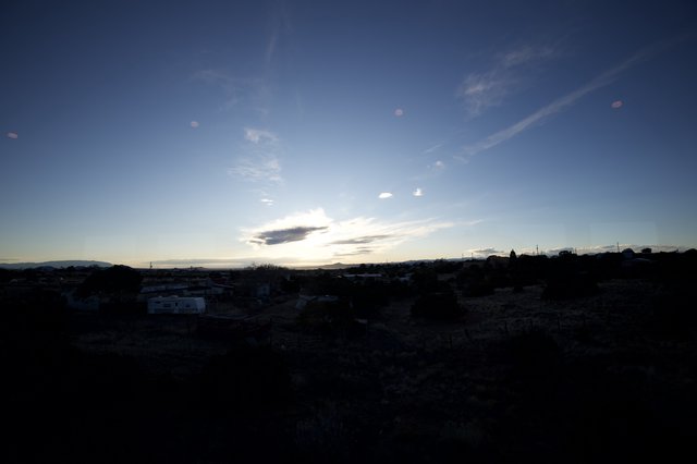 Twilight Over a Silhouetted Rural Township