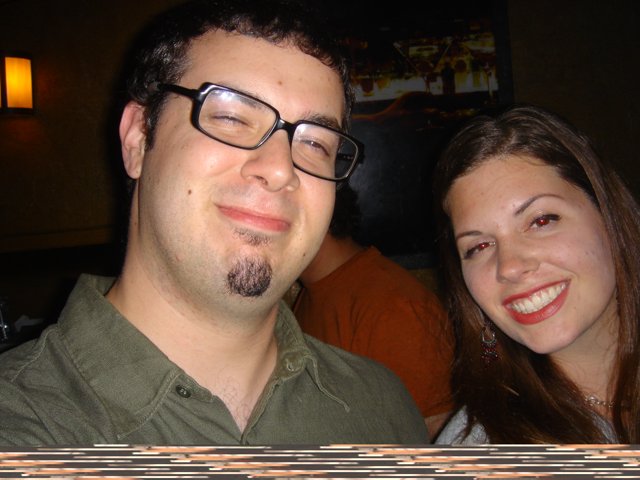 A Smiling Couple with Glasses