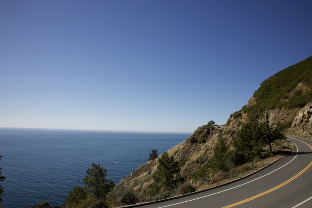 Embracing Serenity - Mountain, Road, and Sea