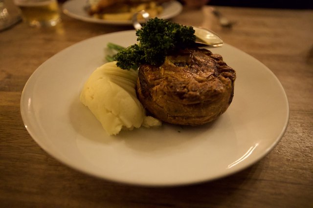 Traditional British Meat Pie with Mash and Broccoli