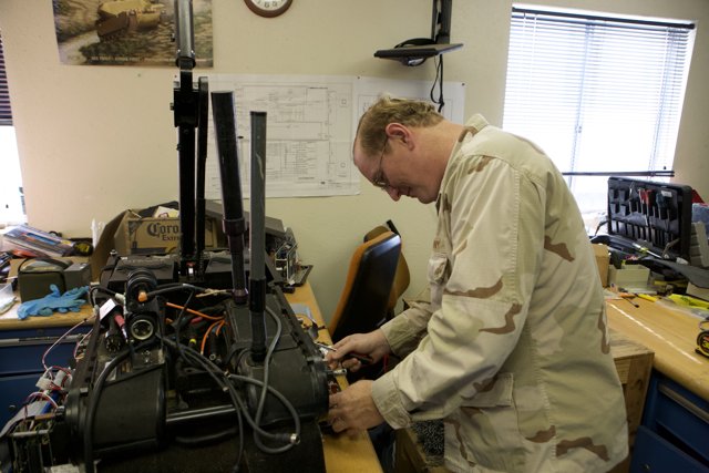 Military Man Working on Machine