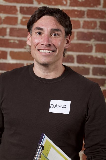 Smiling Man with Name Tag