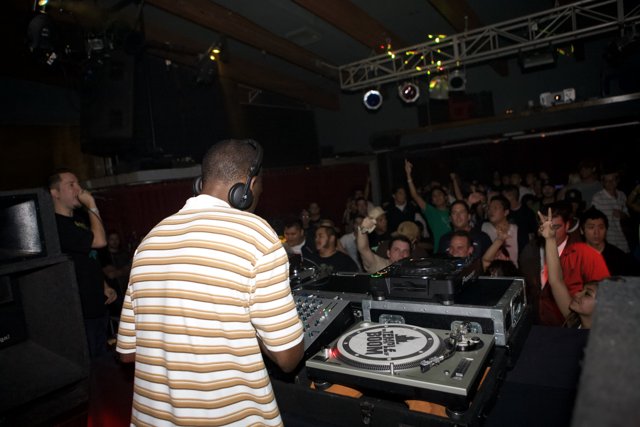 Nightclub Beats: DJ Kenny Ken Entertaining the Crowd