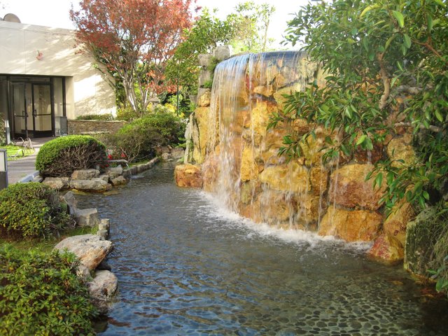 Serene Waterfall in A Garden Oasis