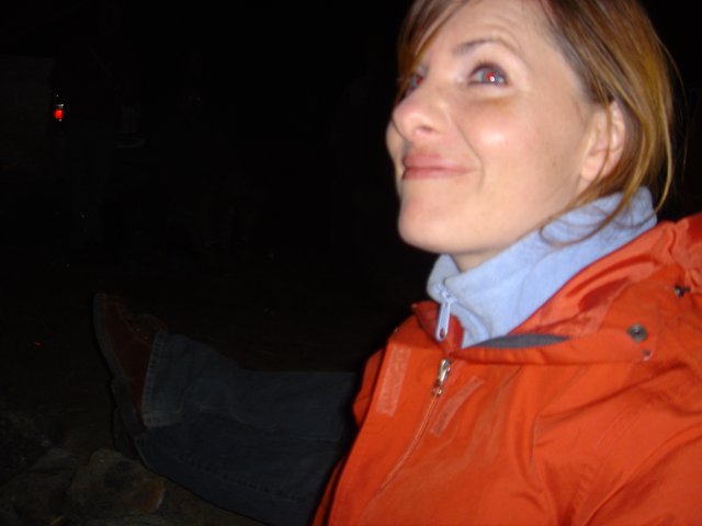 Woman Gazing Upward on a Dark Winter Night