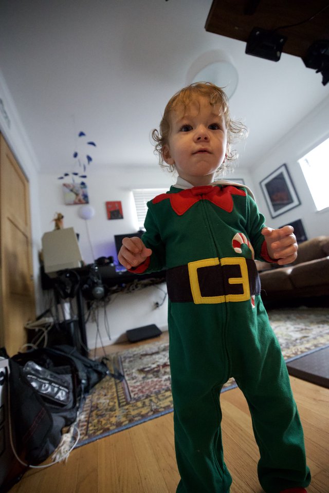 Toddler in Festive Elf Costume at Home