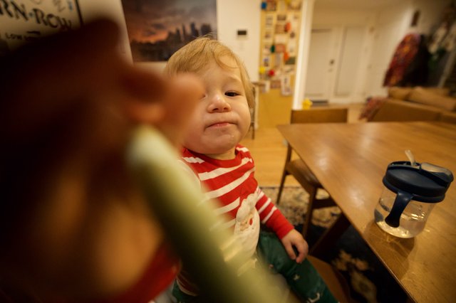 Young Child in Motion at Kitchen Table