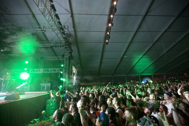 Green Spotlights Illuminate the Enthusiastic Crowd at Coachella