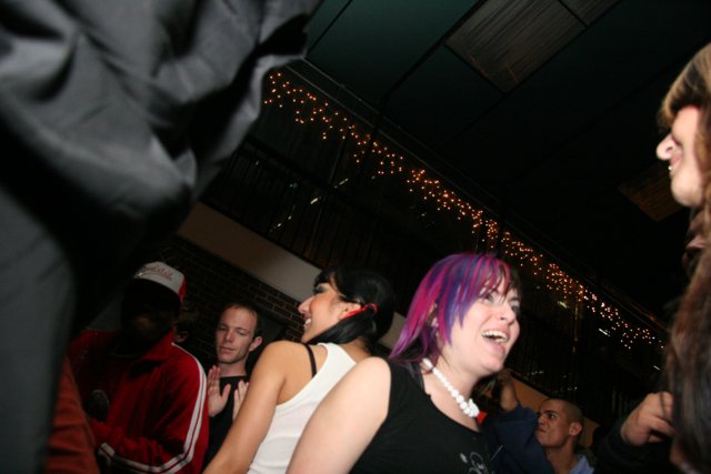 Nightlife Fun with Purple Hair and Black Jackets
