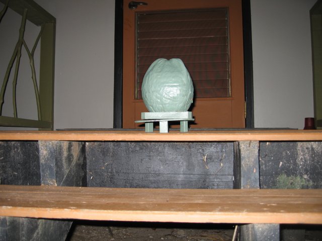 Green Vase on Wooden Table