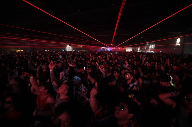 Red Laser Light Show Over Massive EDM Festival Crowd