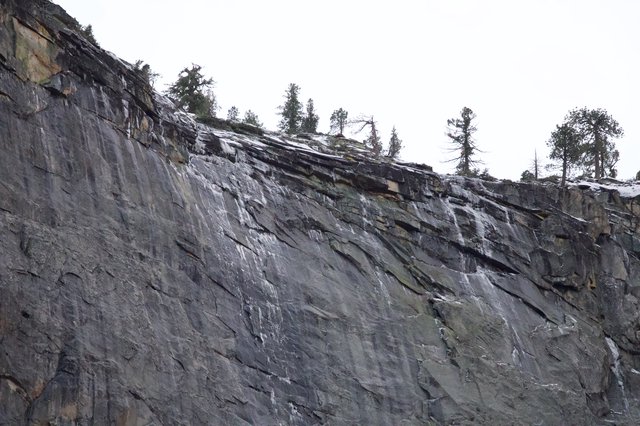 Dramatic Layered Rock Face in Snowy Winter Landscape