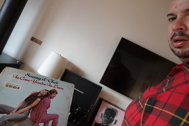 Man Showing Vintage Sonny & Cher Album