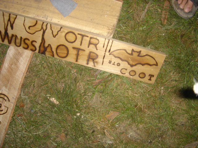 Wooden Sign with Bat Symbol