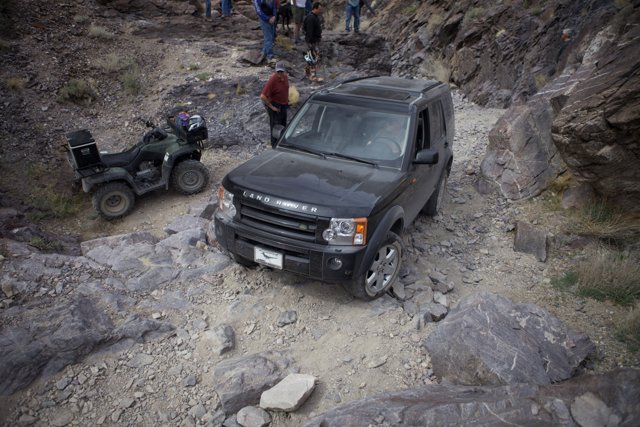 Black Land Rover on a Rocky Adventure
