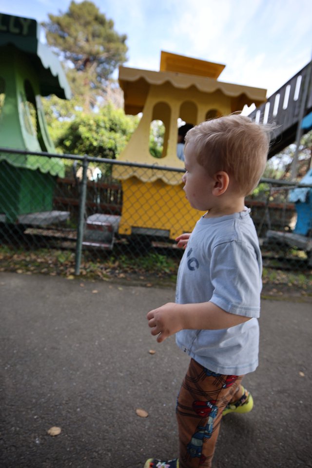 Young Boy Exploring Colorful Playground at Fantasyland