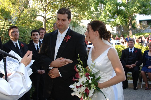 Bride and Groom Exchange Vows at Outdoor Wedding