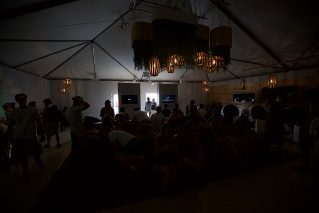 Chandelier Shines over Crowded Tent