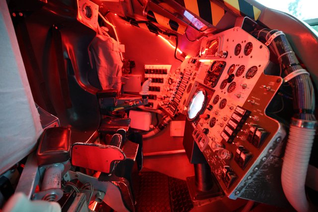 Interior of Historic Aircraft Cockpit with Red Lighting