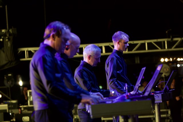 A Group of Musicians Rocking the Keyboard