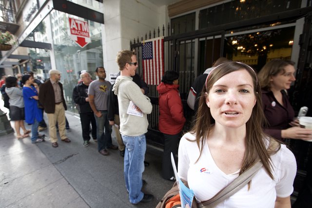 Proud Voter Stands Outside Polling Place on Election Day