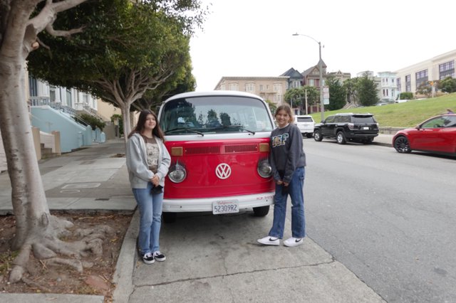Friends Posing with Classic Volkswagen Bus