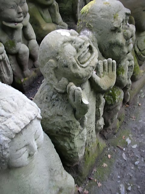 Stone Statues with Moss and Plants