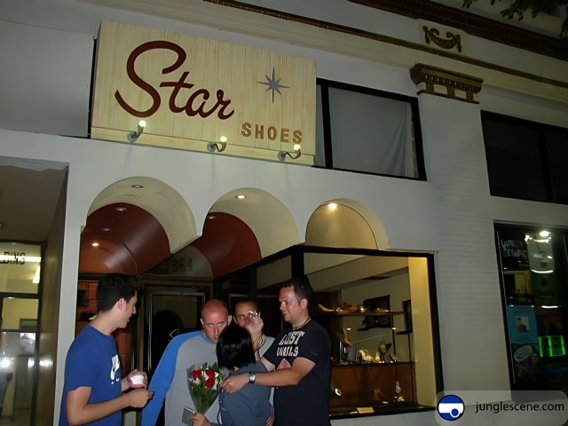 People Gather Outside Star Shoes Store
