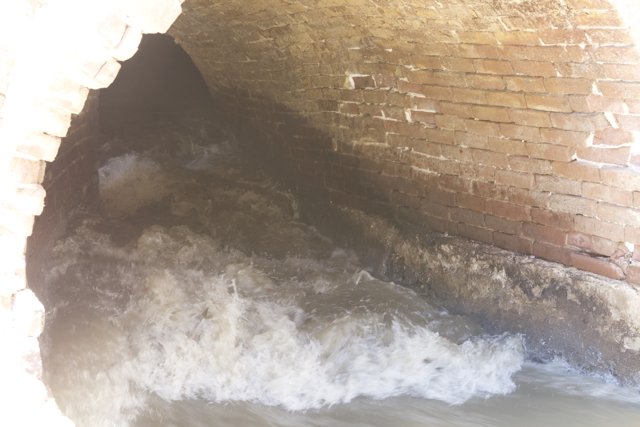 Brick Tunnel with Flowing Water
