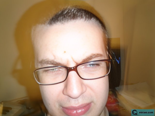 Blurry Portrait of a Sad Man with Glasses