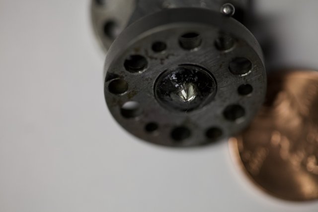 Close-up of Penny and Metal Object