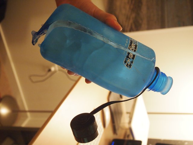 Blue Water Bottle in Hand