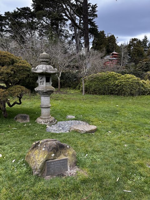 Tranquil Japanese Garden with Stone Lantern and Bench