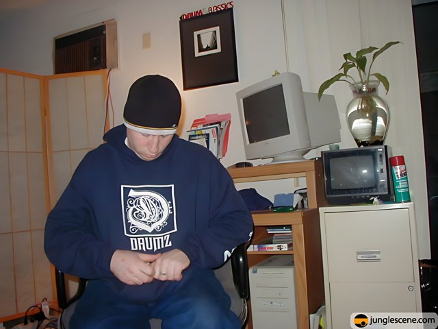 Blue Hoodie and Computer Monitors