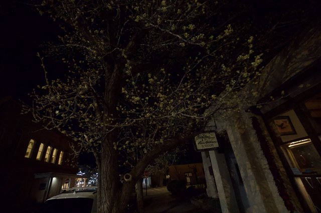 Moonlit Plaza with Historic Adobe Architecture at Night