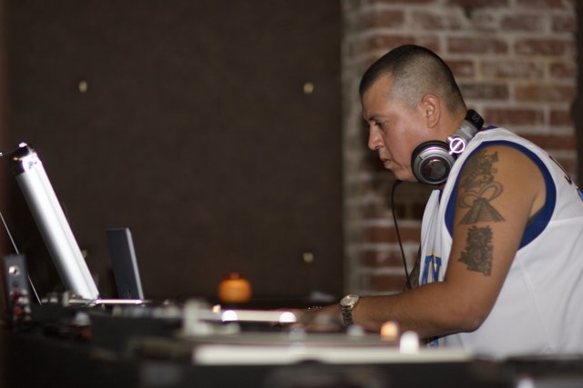 Tattooed DJ Spins the Night Away