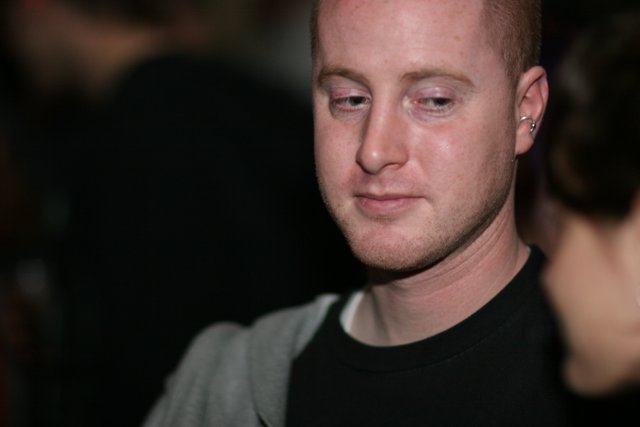 Red-Haired Man in Black Shirt