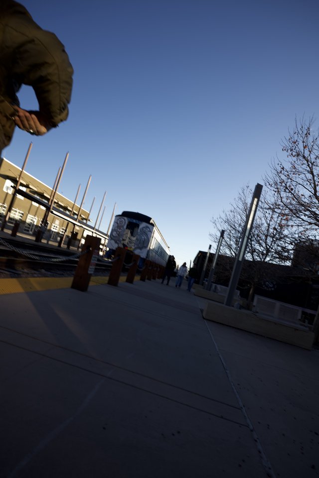 Low Angle Urban Plaza with Train Mural at Dusk
