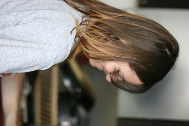 Woman Smiling in Kitchen with Ombré Hair