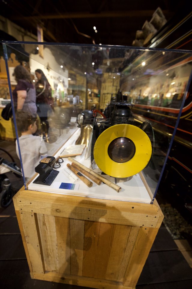 Museum Display Case with Vintage Yellow Record and Scientific Instruments