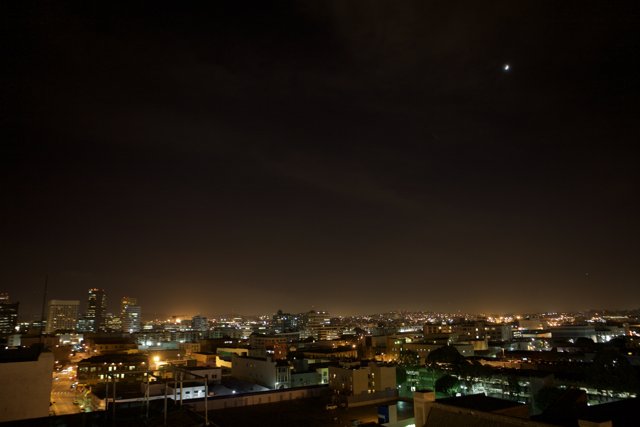 Lunar Eclipse Over the Cityscape