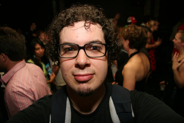 Curly Haired Dave B in the Nightlife Crowd