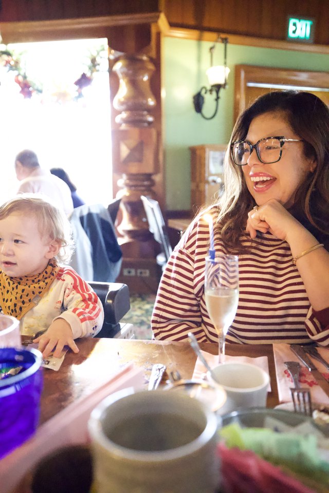 Mother and Child Dining at Restaurant Interior
